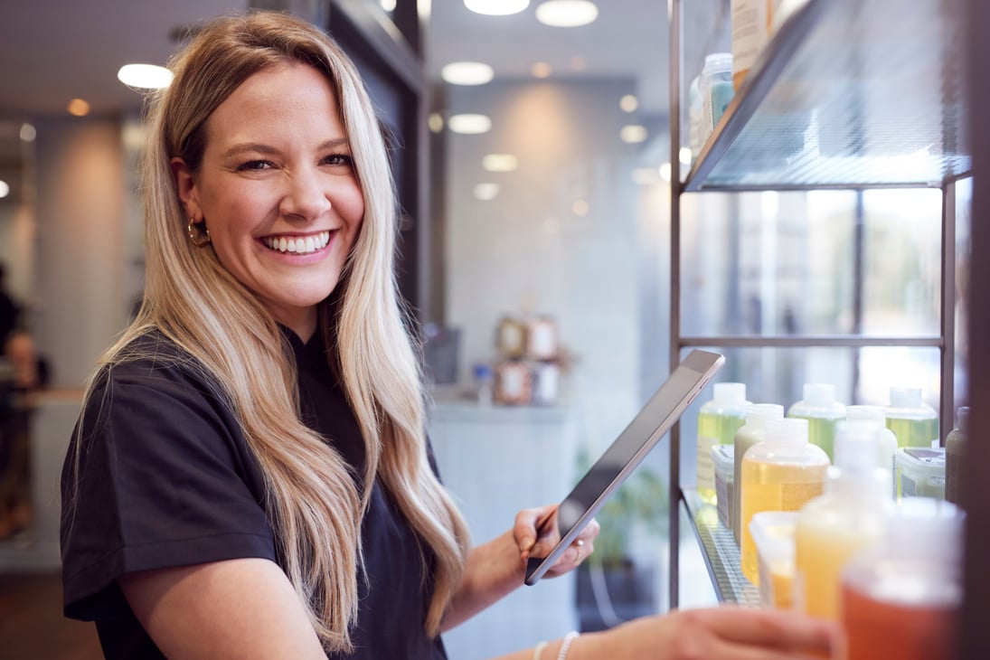 Portrait of Female Business Owner in Hairdressing Salon with Dig